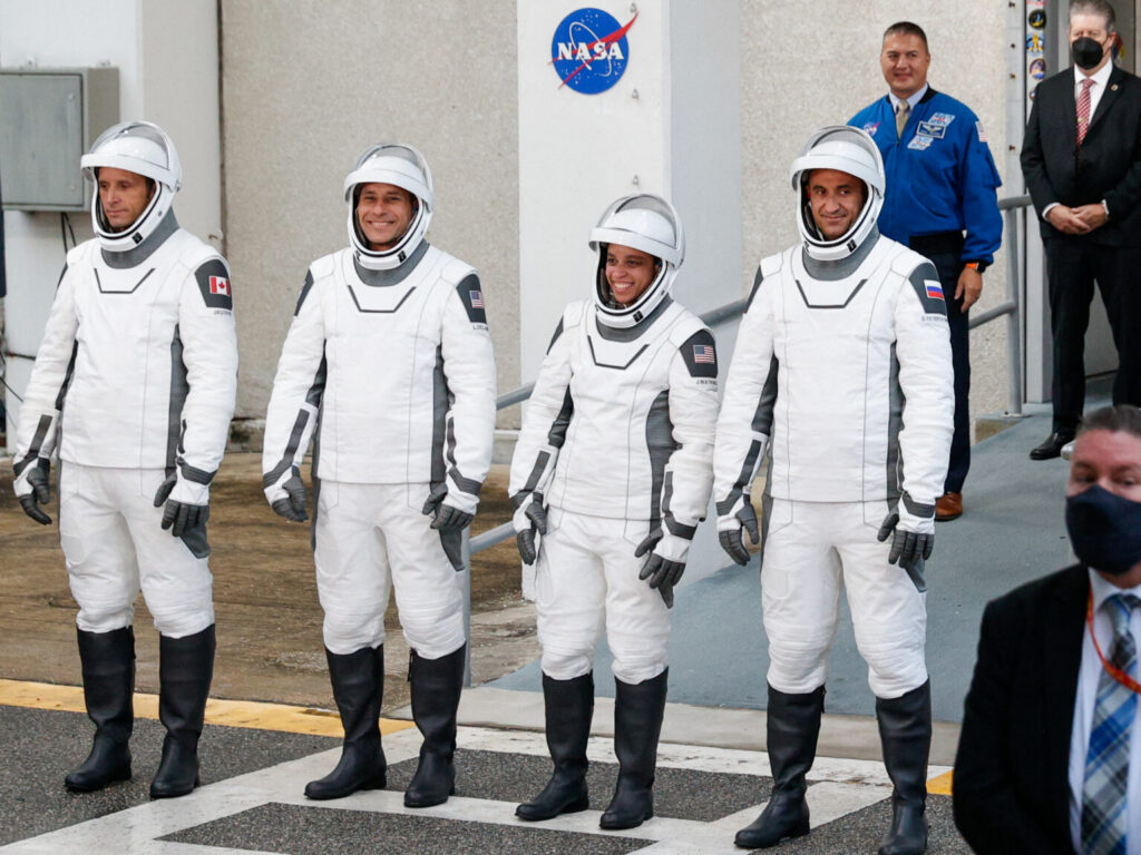 Four astronauts reach International Space Station in record time